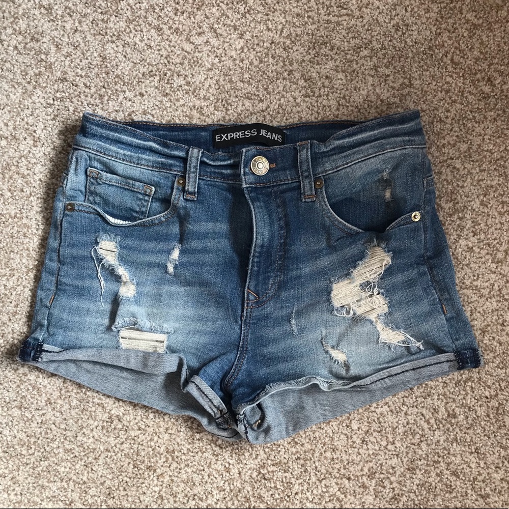 Distressed blue jean shorts